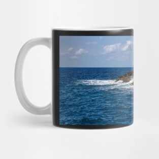 Waves beating against the rocks Mug